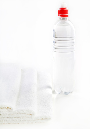 Bottle of water and towelの写真素材