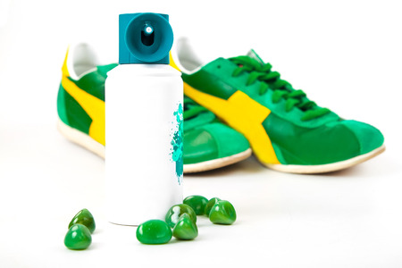 Bottle spray of sports men perfume, sneakers, sunglasses on white 