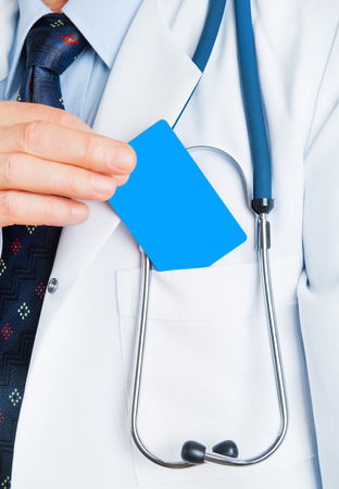 Closeup of business card in doctorの写真素材