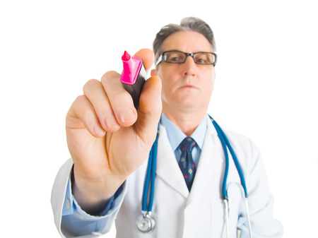 Male Doctor with scientist glasses writing something with marker on glass, wallの写真素材