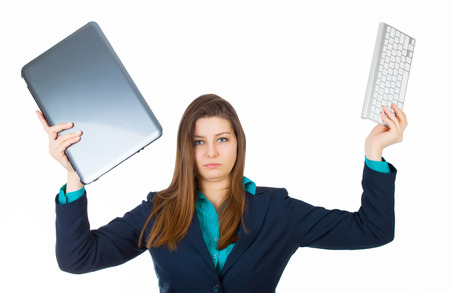 Young business woman with laptop, keyboard isolated on whiteの写真素材