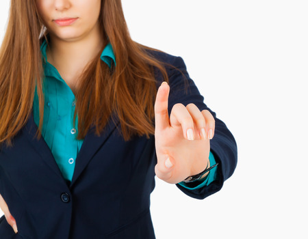 Business woman pointing her finger on imaginary virtual buttonの写真素材