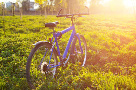 New mountain bicycle in park at sunsetの写真素材