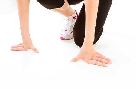 Fitness. Feet of jogging person on white background