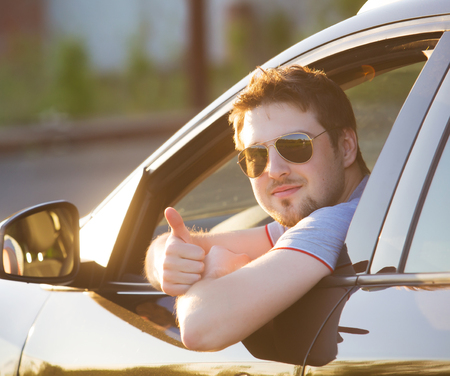 Portrait of a man driving a car