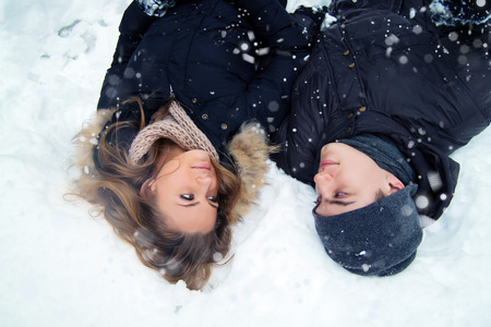 Happy Couple Having Fun Outdoors. Snow. Winter Vacation. Outdoor