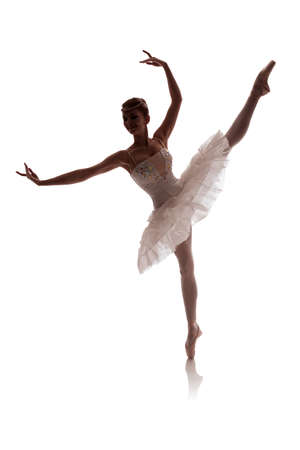 woman ballerina in white pack posing on white background photo made in the style of "low key"の写真素材