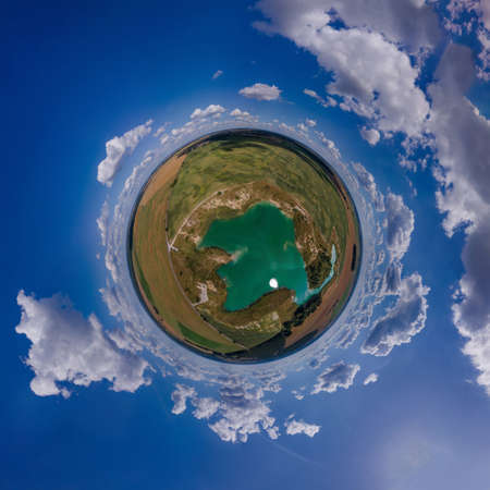 Panoramic view from drone, small planet and blue sky around the globeの写真素材