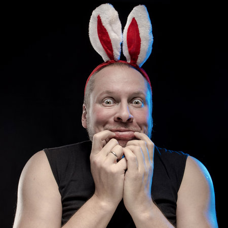 Comic actor man with bunny ears, on the eve of Christmas and New Year
