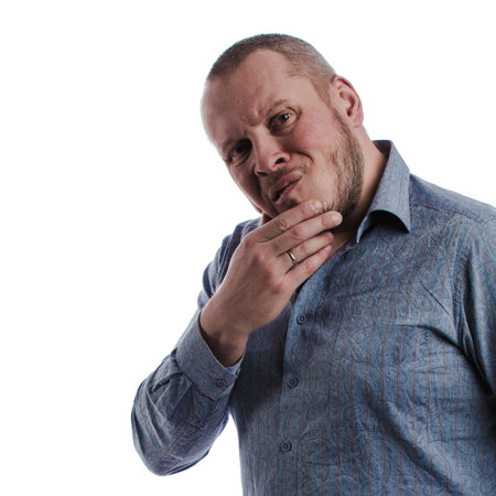 emotional actor man in a gray shirt posing on a white background in studioの写真素材