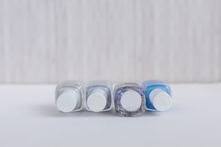 Collection of colored bottles of nail polish and gel. Layout for design.の写真素材