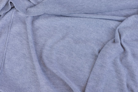 Texture of crumpled gray knitwear drapery, background for design