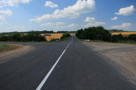 Highway wide road, transport and blue sky with clouds on a summer day