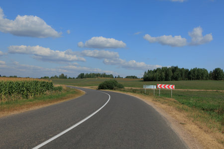 Highway wide road, transport and blue sky with clouds on a summer day