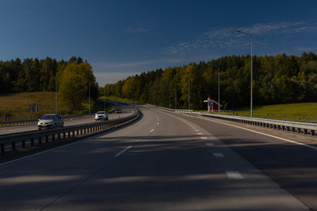 Highway wide road, transport and blue sky with clouds on a summer day