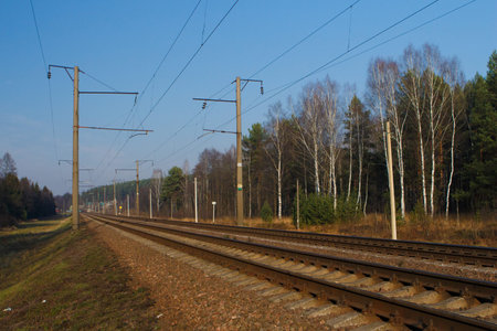 Railway tracks on a summer day and a view of the station