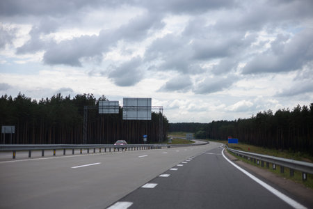 Highway wide road, transport and blue sky with clouds on a sunny summer day