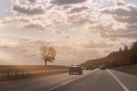 Highway wide road, transport and blue sky with clouds on a summer day