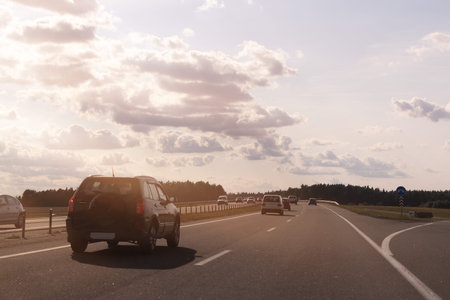 Highway wide road, transport and blue sky with clouds on a summer day