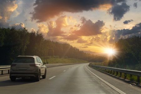 Evening view at sunset. Highway road in the countryside, roadside and asphaltの写真素材