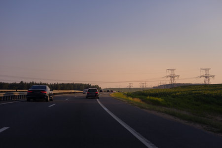 Evening view at sunset. Highway road in the countryside, roadside and asphaltの写真素材