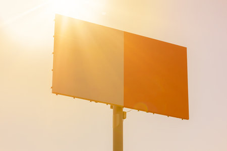 Advertising billboard along the road in the city on a sunny day. Background for design.の写真素材