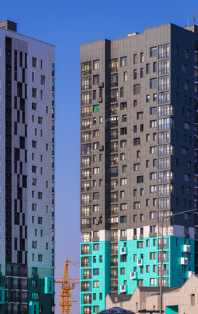 Texture of modern buildings, background for design. Elements of architectural decorations of buildings, modern windows, walls and balconies.の写真素材