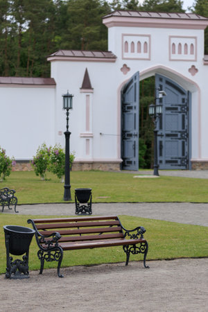 Wooden benches and chaise lounges for rest on the streets of the city and in the parkの写真素材