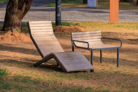 Wooden benches and chaise lounges for rest on the streets of the city and in the park, public places