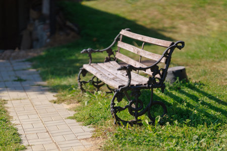 Wooden benches and chaise lounges for rest on the streets of the city and in the park, public placesの写真素材