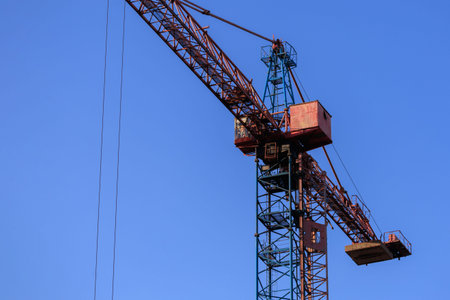 Construction of buildings and high-rise cranes against the sky