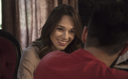 Young beautiful woman with brown eyes smiling to manの写真素材