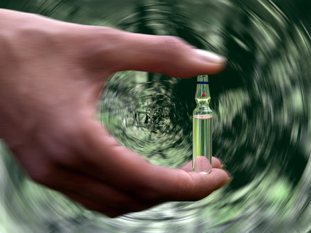 Female hand holding a vial of medicine. Background volume, gloomy tunnel, motion, speed. The concept...