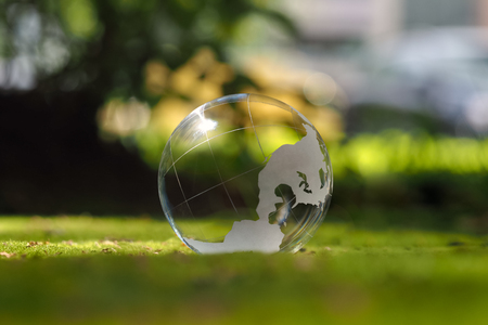 Transparent sphere. Green moss. The concept of ecology, environmental protectionの写真素材