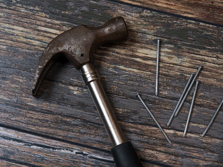 old rusty tools lying on an old wooden floorの写真素材