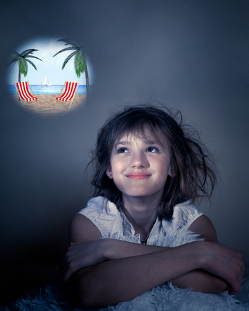 Girl dreaming of vacation, traveling to a hot countryの写真素材