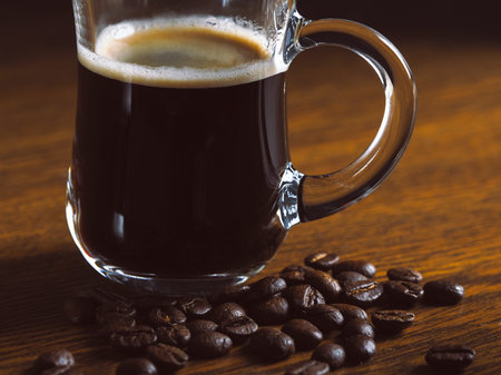 Luxury coffee mug on the table. Coffee bean