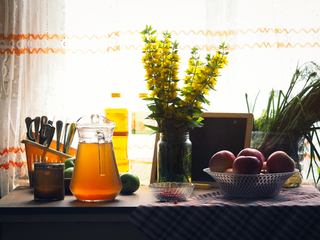 Table by the window with the usual village products and household items. Natural still lifeの素材 [FY310115398523]