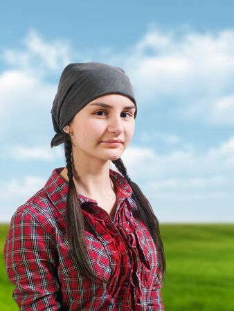 Portrait of a young girl farmer in the fieldの写真素材
