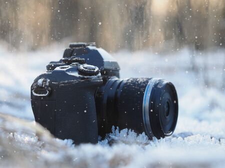 Camera on the snow in the frost.の写真素材