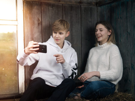 Teenagers are photographed with a smartphone camera