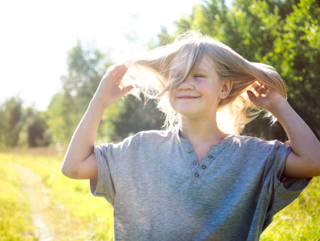 Happy child in nature. Portrait of a girl