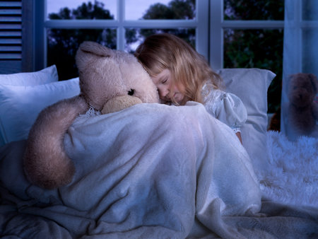 Night sleep of a child with a toy
