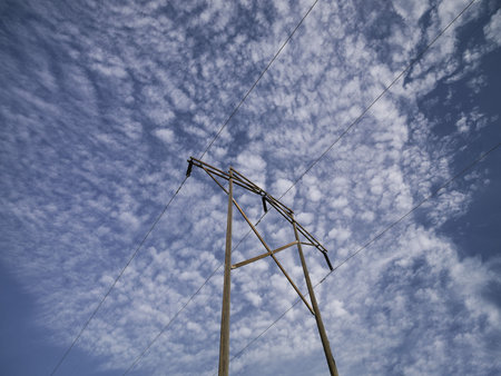 Brightly Lite Hydro Wire Lines against Cloud Formation