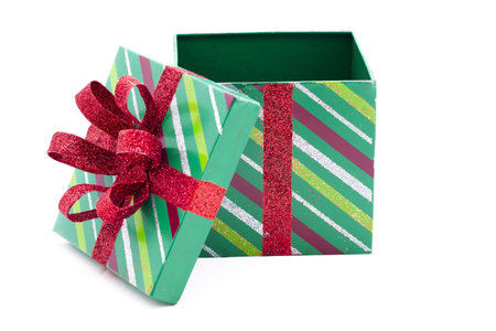 View of empty green Christmas gift box over white background.の写真素材