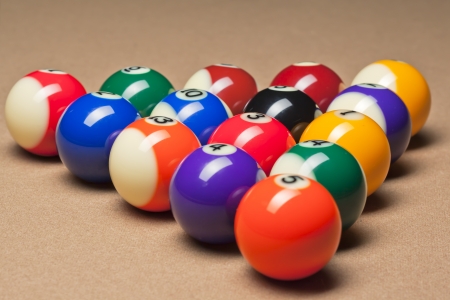 Fifteen billiard spheres lay on brown tableの写真素材