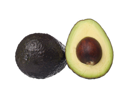 Image of a fresh avocado fruit lying on a white background