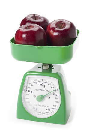 Shot of fruit on a green scale の写真素材