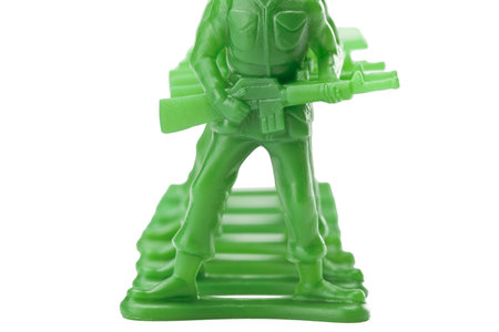 Cropped and close up green military miniature against white backgroundの写真素材