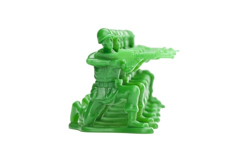 Horizontal image of a kneeling army miniatures against white backgroundの写真素材